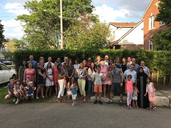 Dozens of SickKids associates smiling outside during the 2018 - 2019 Summer BBQ  