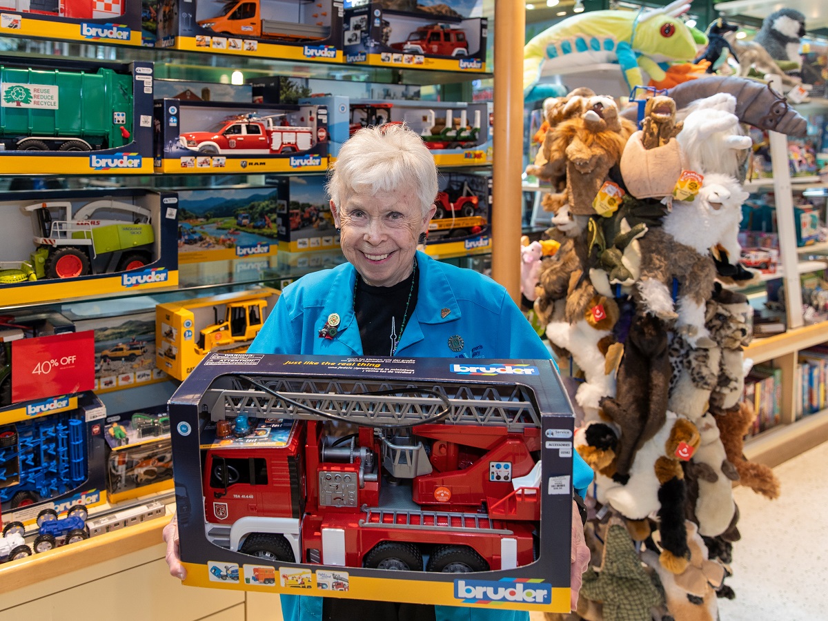 Person holds toy fire truck
