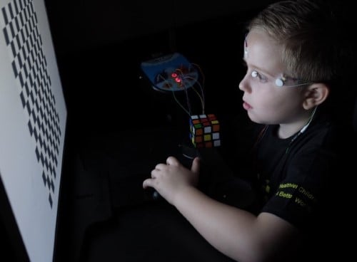 A boy undergoing a visual electrophysiology test 