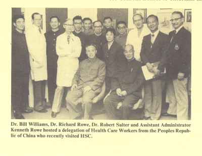 Medical professionals from HSC hosting Chinese healthcare delegation - doctors in white coats alongside visiting Chinese delegates.