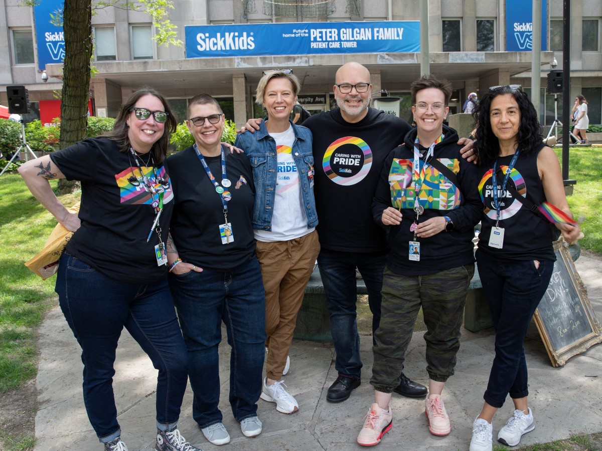 Group of staff wearing SickKids Pride t-shirts.