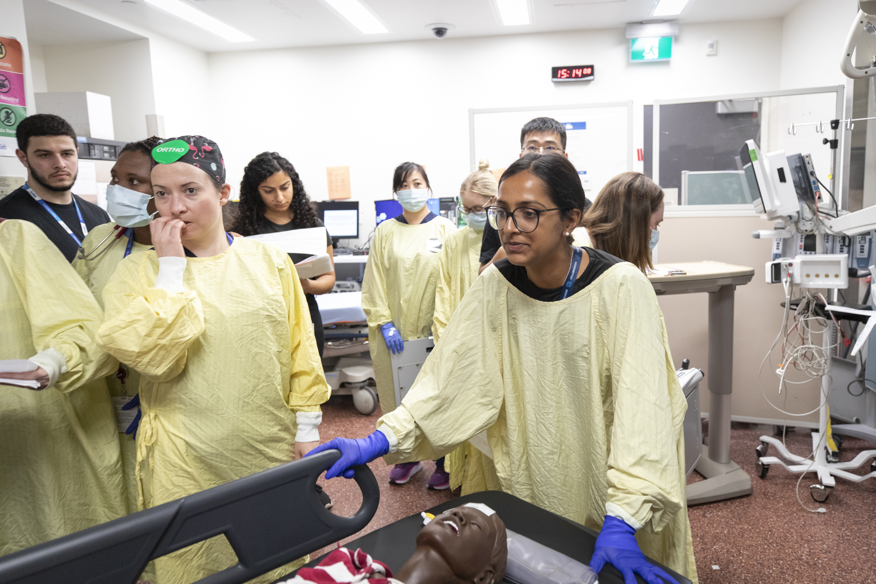 A simulated patient is brought into the trauma room from the emergency bay as part of the hospital’s simulation. 