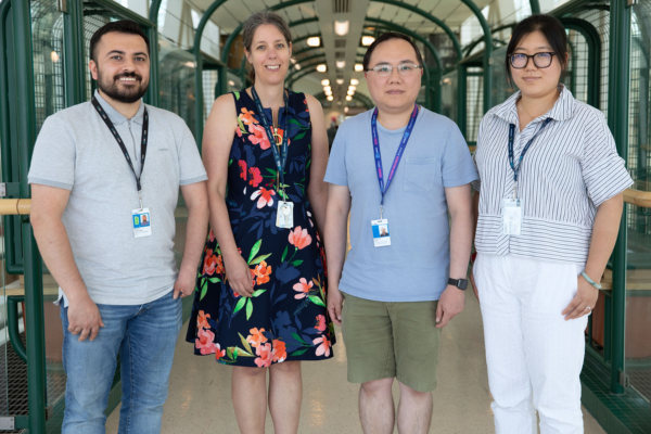 Group photo of Mustafa, Karin, Raymond and Kai in the Atrium.