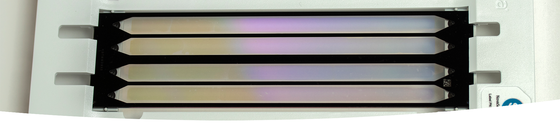 Patterned flow cell technology. A rectangular piece of equipment with tiny wells arranged in an array.